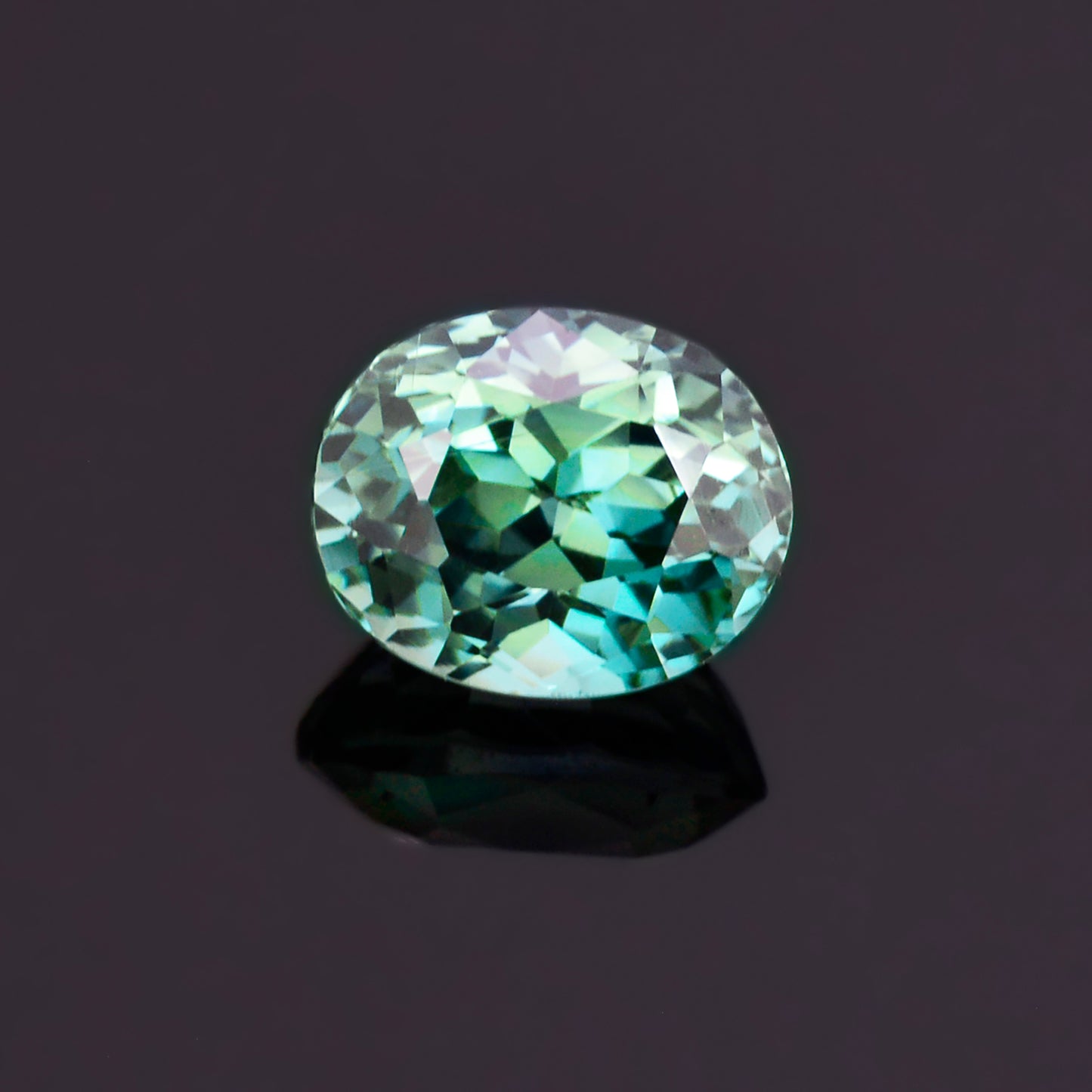 Sapphire, 1.51 cts., 6.7x5.5 mm., Oval, Bicolor, Teal, Blue, Green, Madagascar, Natural, GIA Cert.