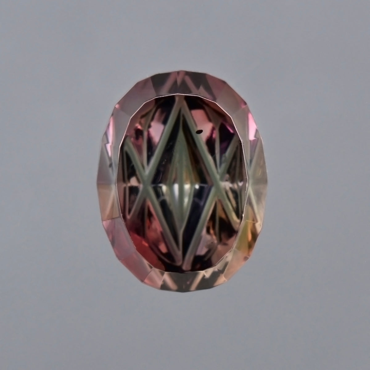 Dragon Sapphire, 1.42 cts., 7.0x5.4 mm, Fantasy Oval, Purple, Pink, Orange, Green, Tanzania, Natural