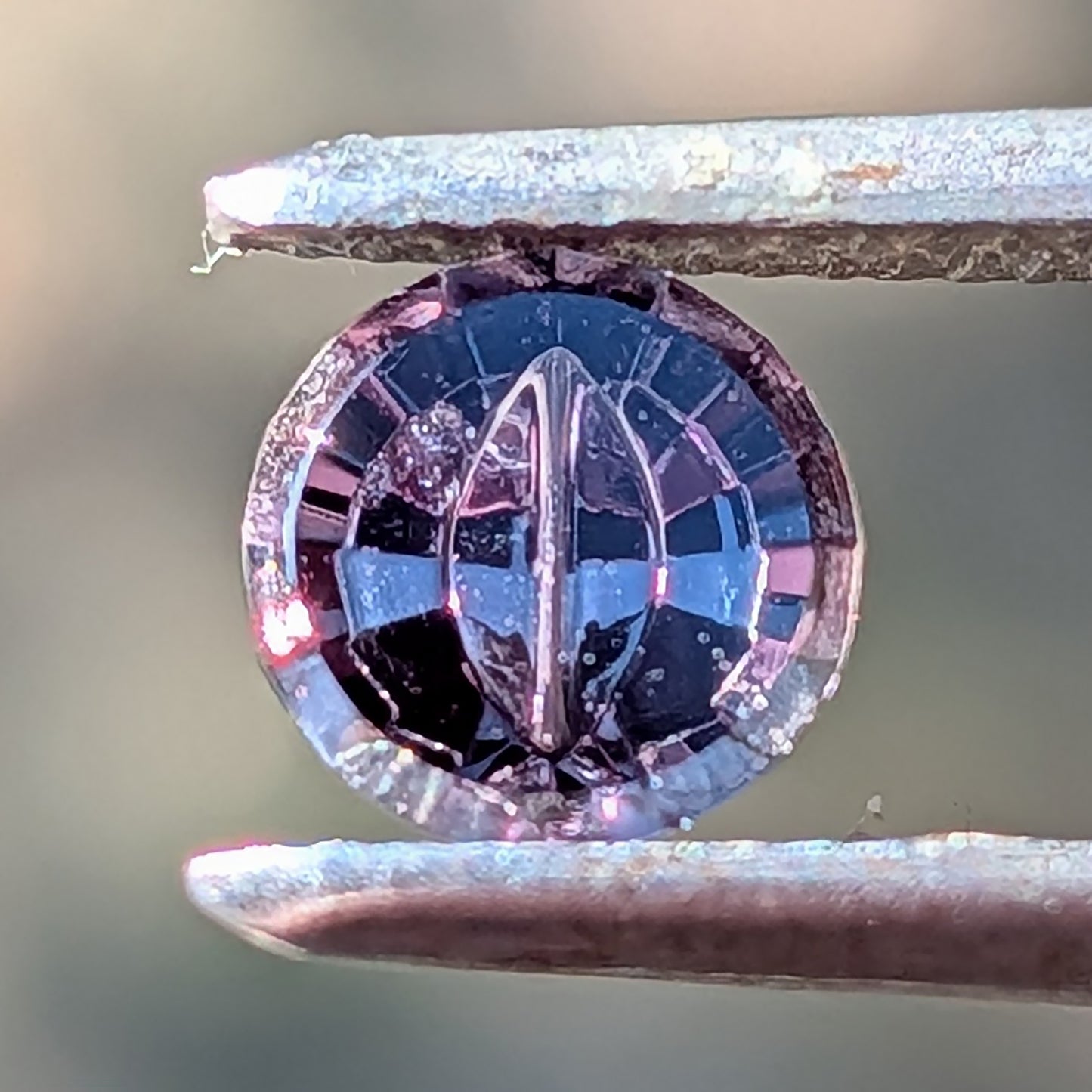 Dragon Sapphire, 0.64 cts., 5.6 x 2.4 mm, Fantasy Dragon Eye Round, Purple, Tanzania, Natural
