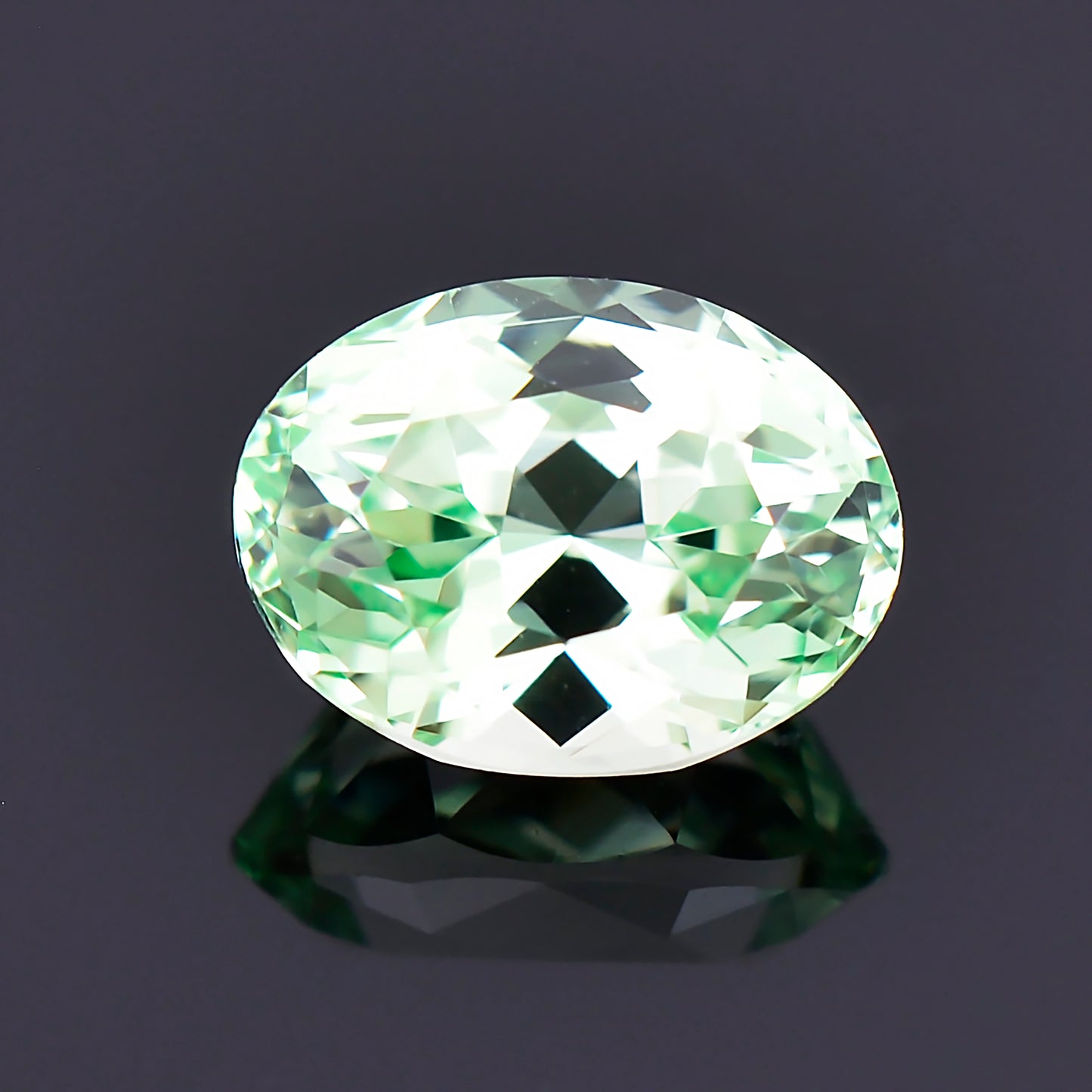 Grossular Garnet, 1.38 cts., 7.4x5.6 mm., Oval, Green, Tanzania, Natural