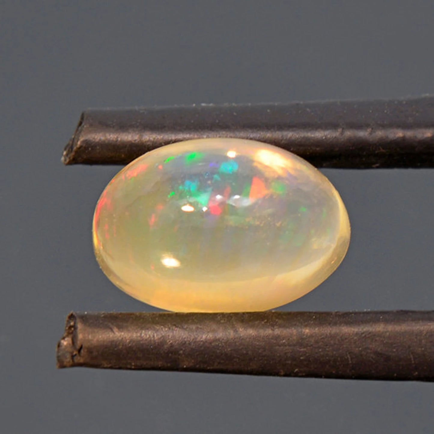 Fantastic Fire Opal Cabochon with Multi Color Flash from Mexico 2.46 cts.