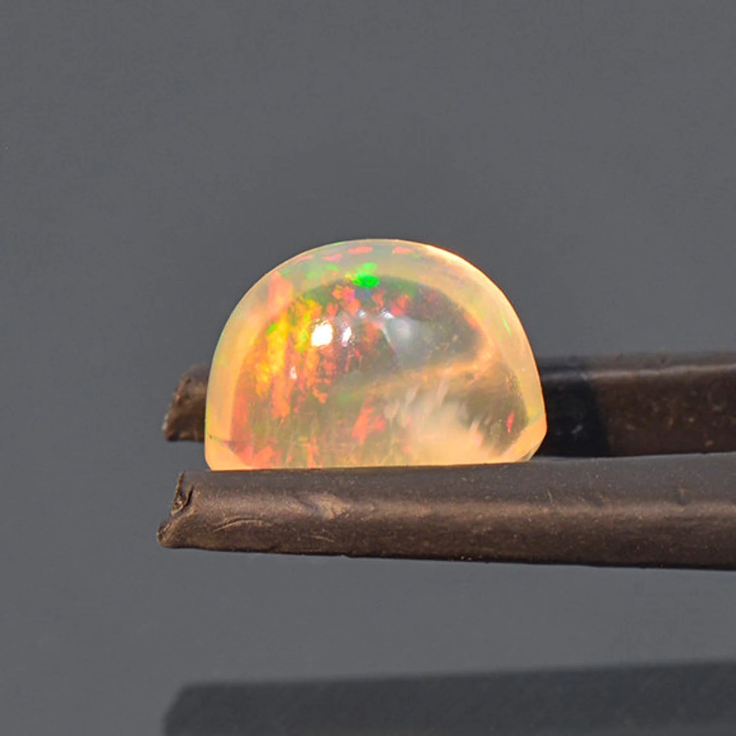 Fantastic Fire Opal Cabochon with Multi Color Flash from Mexico 2.46 cts.