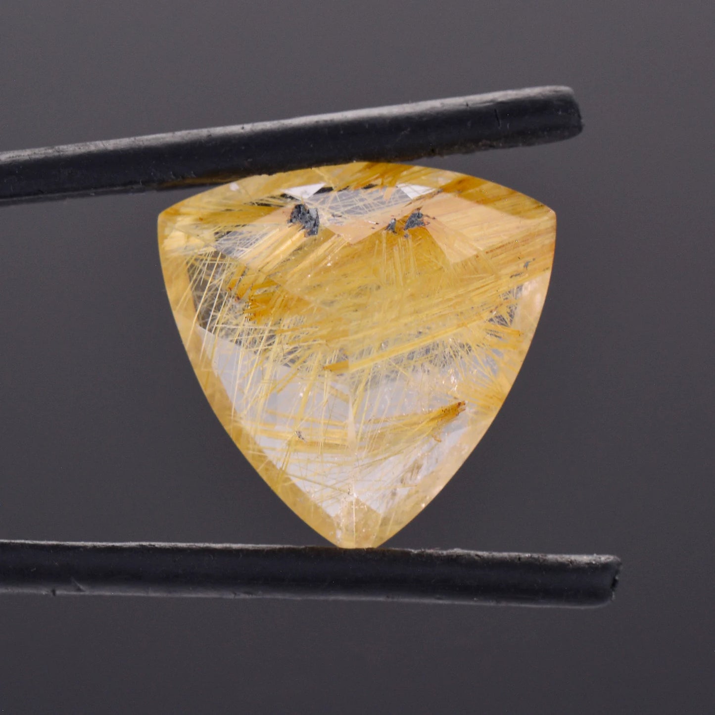 Intriguing Quartz with Rutile Inclusion Gemstone from Brazil, 12.13 cts., 16 mm., Trillion Shape