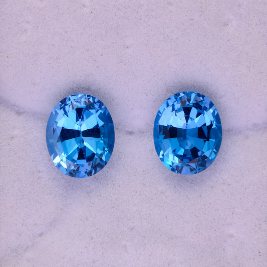 Stunning Swiss Blue Topaz Gemstone Match Pair, 9.78 tcw., 11x9 mm., Oval Shapes