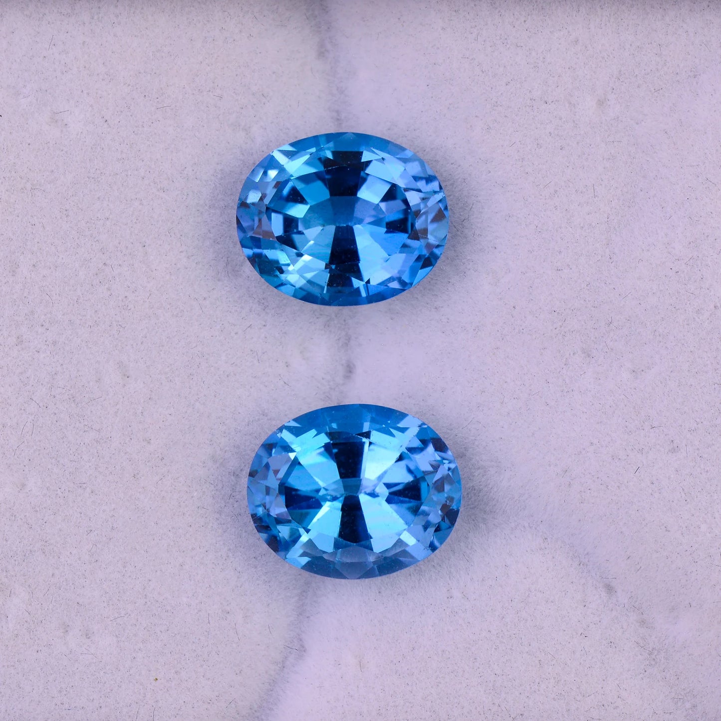 Stunning Swiss Blue Topaz Gemstone Match Pair, 9.78 tcw., 11x9 mm., Oval Shapes