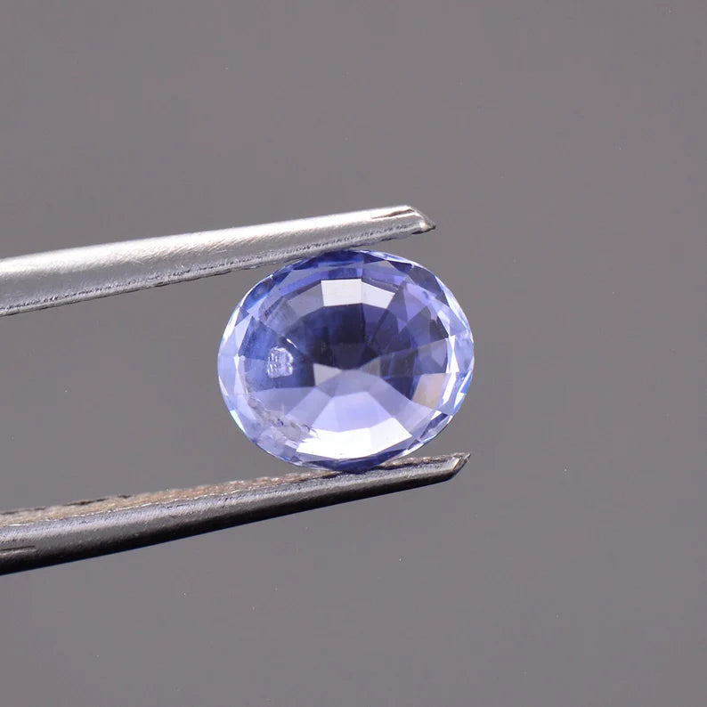 Fascinating Blue Sapphire Gemstone with Negative Crystal Inclusion, 1.51 cts., 7 x 6 mm., Oval Shape