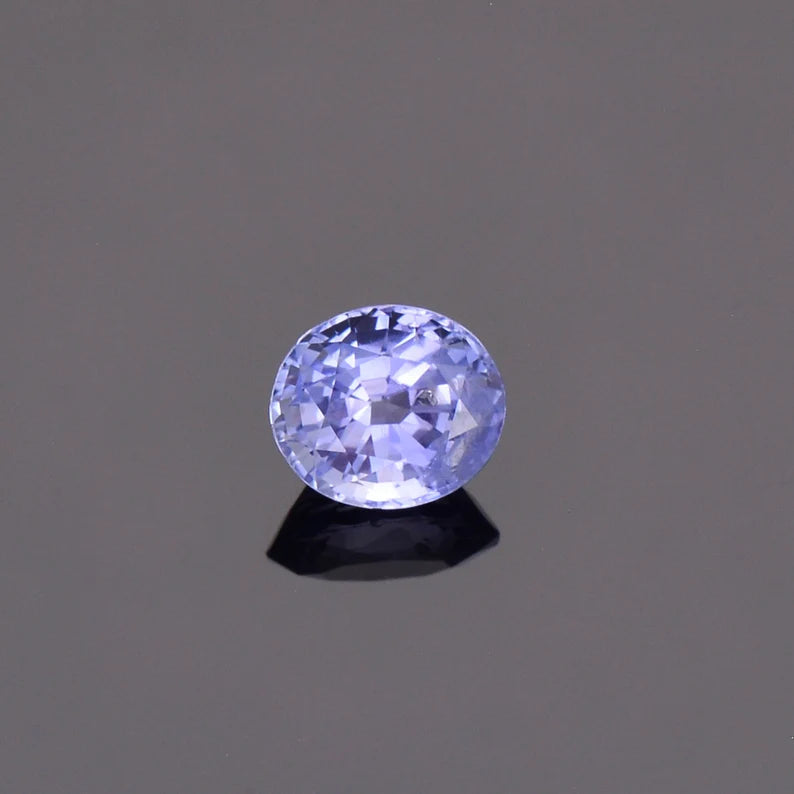 Fascinating Blue Sapphire Gemstone with Negative Crystal Inclusion, 1.51 cts., 7 x 6 mm., Oval Shape