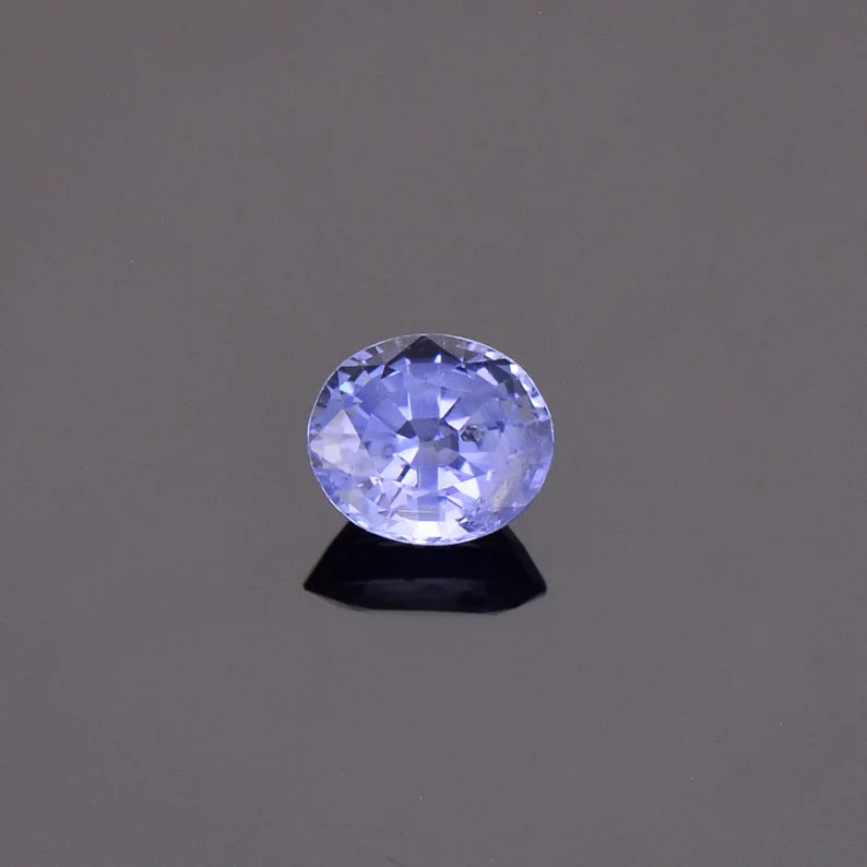 Fascinating Blue Sapphire Gemstone with Negative Crystal Inclusion, 1.51 cts., 7 x 6 mm., Oval Shape