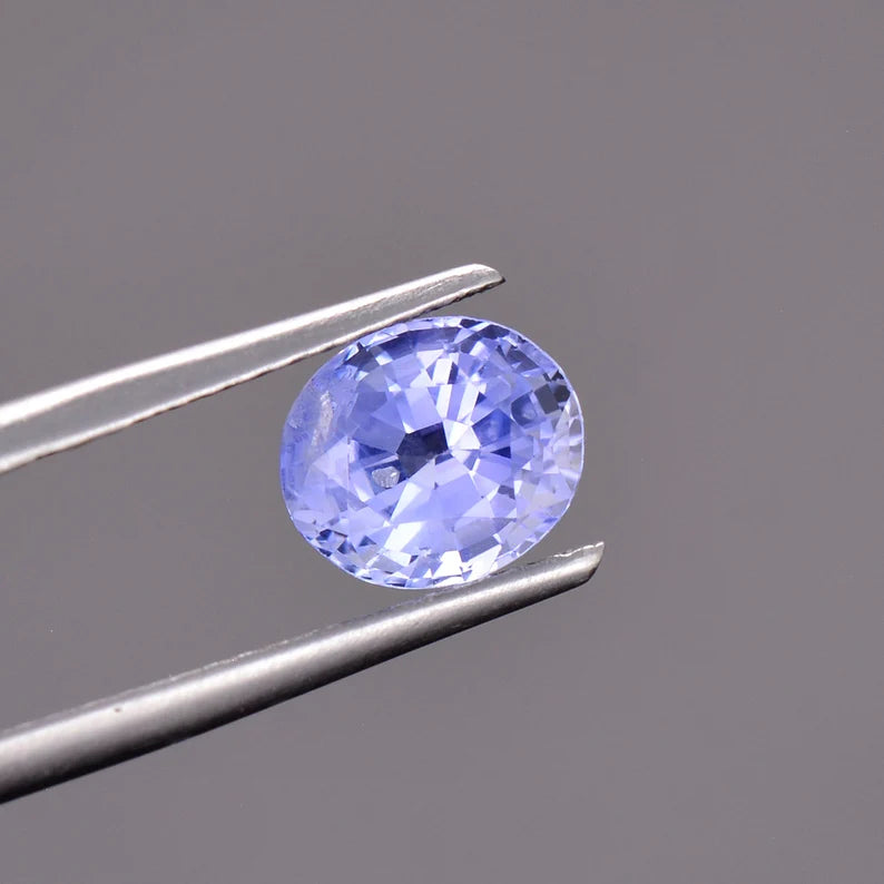 Fascinating Blue Sapphire Gemstone with Negative Crystal Inclusion, 1.51 cts., 7 x 6 mm., Oval Shape