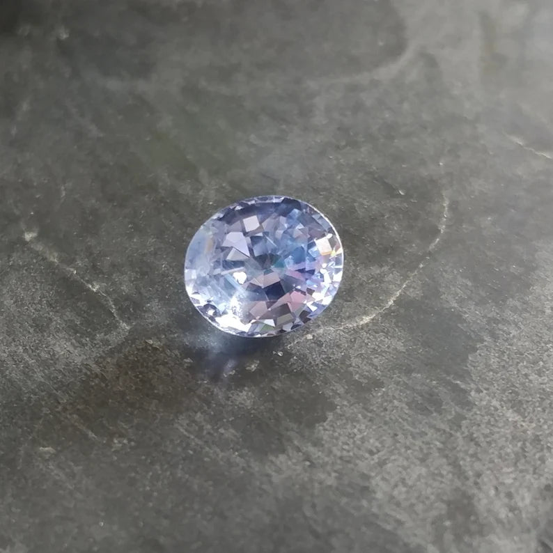 Fascinating Blue Sapphire Gemstone with Negative Crystal Inclusion, 1.51 cts., 7 x 6 mm., Oval Shape