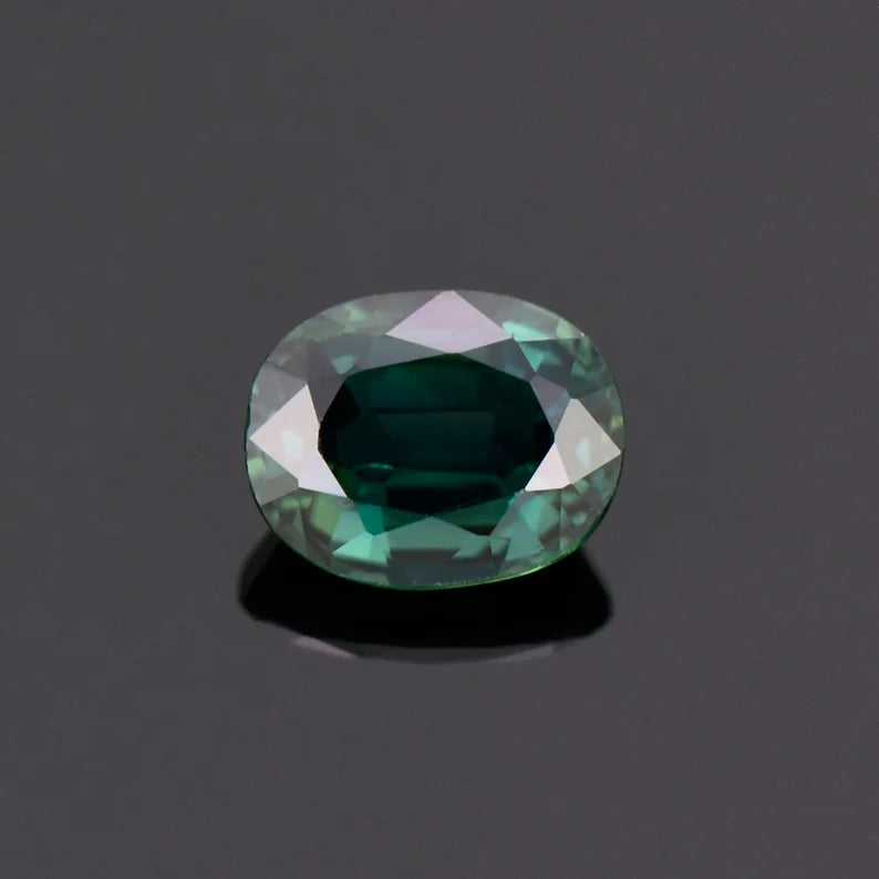 Fine Dark Teal Sapphire Gemstone from Australia, 0.88 cts., 6.1x4.9 mm., Oval Shape